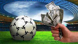 Jogador de futebol comemorando gol em aposta esportiva no 944BET cassino.
